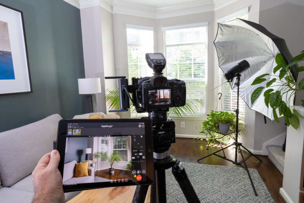 A behind-the-scenes photo of photography equipment in a living room.